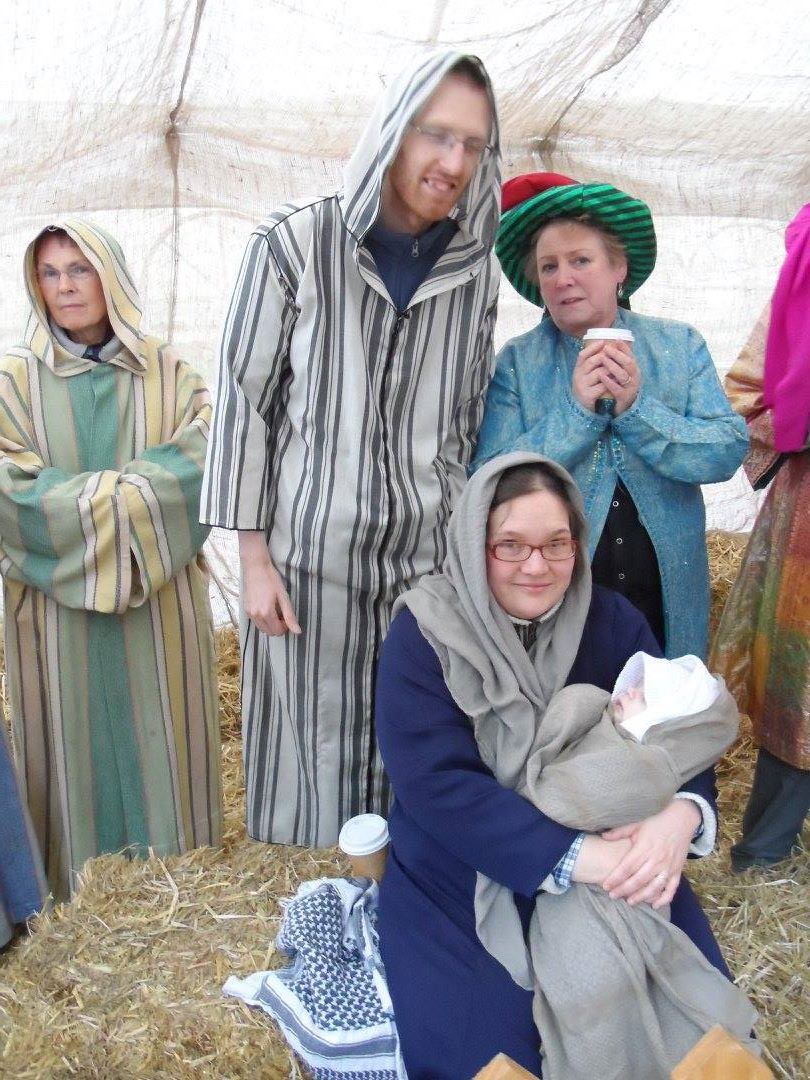 Family in nativity scene