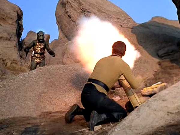 Captain Kirk firing his improvised diamond cannon at the Gorn captain